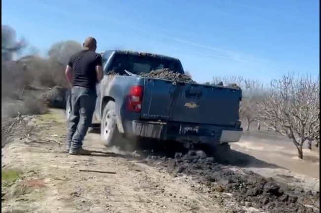 video, trucks, watch farmer drive ford and chevy into the levee to save farm from floods