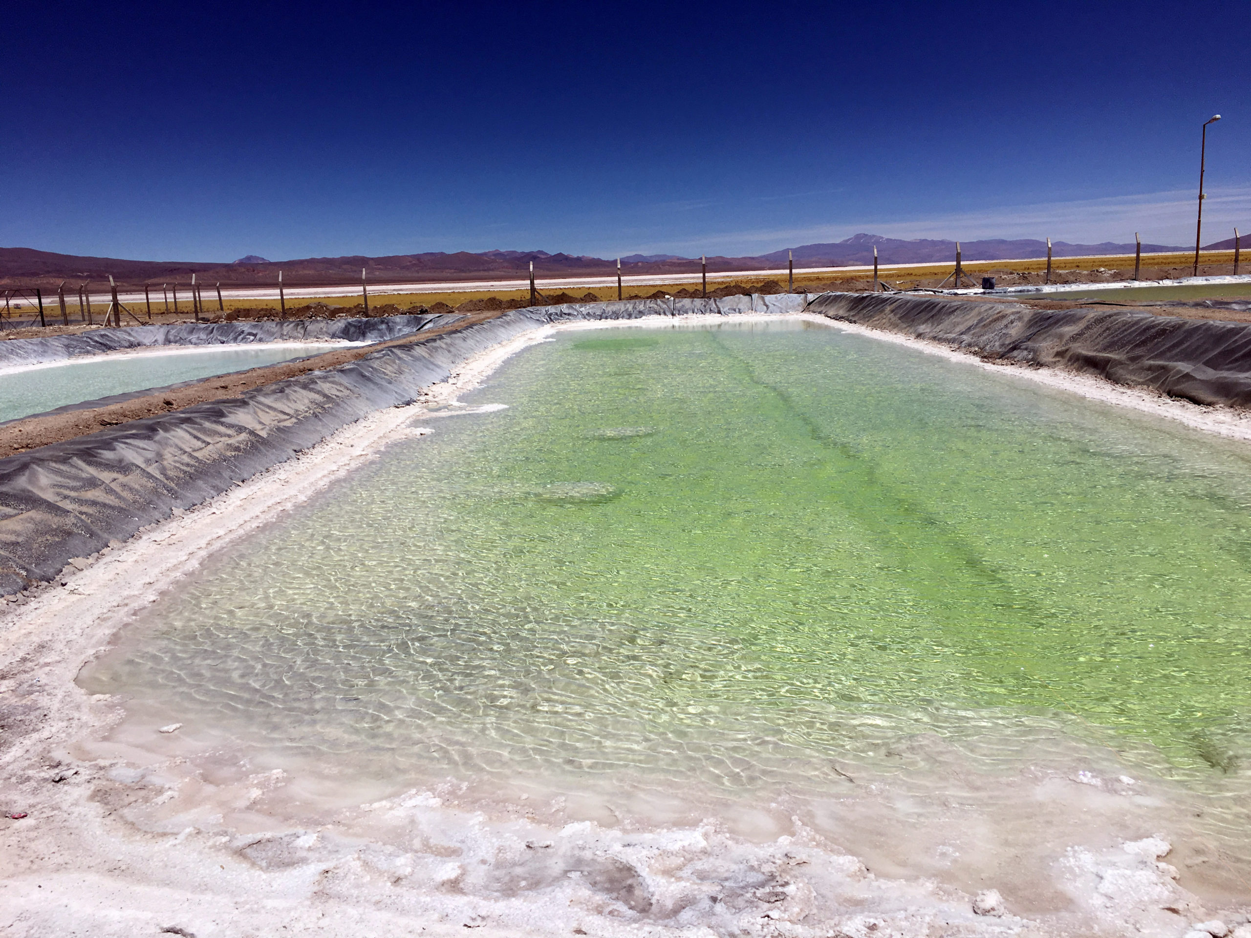 A brine pool used to extract lithium is seen at a salt flat of Cauchari Olaroz near Susques