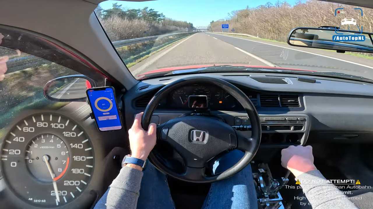 The speedometer and tachometer of a 1993 Honda Civic are maxxed out in this top-speed run on Germany's autobahn.