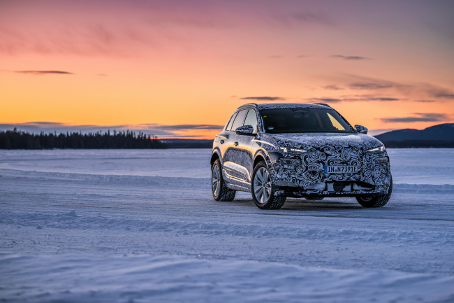audi puts the near production prototype of the q6 e tron through its paces in the far north