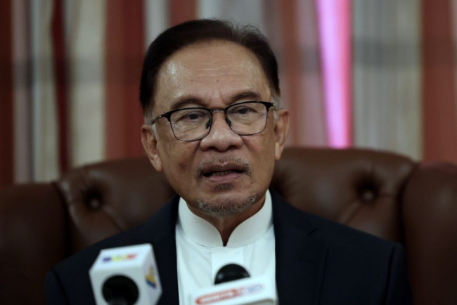 autos news, govt reviewing all monopolies to provide better service for the people, says anwar