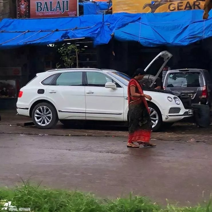 bentley bentayga worth crores of rupees getting fixed at a roadside garage in mumbai stuns the internet