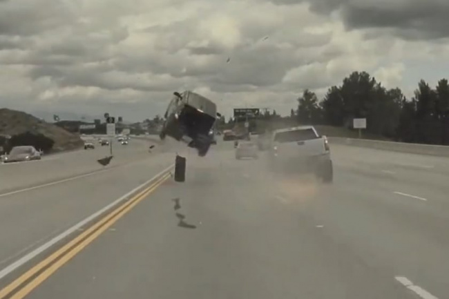 off-road, offbeat, watch a rogue truck tire blast a kia soul 15 feet into the air on the freeway