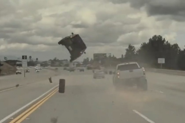 off-road, offbeat, watch a rogue truck tire blast a kia soul 15 feet into the air on the freeway