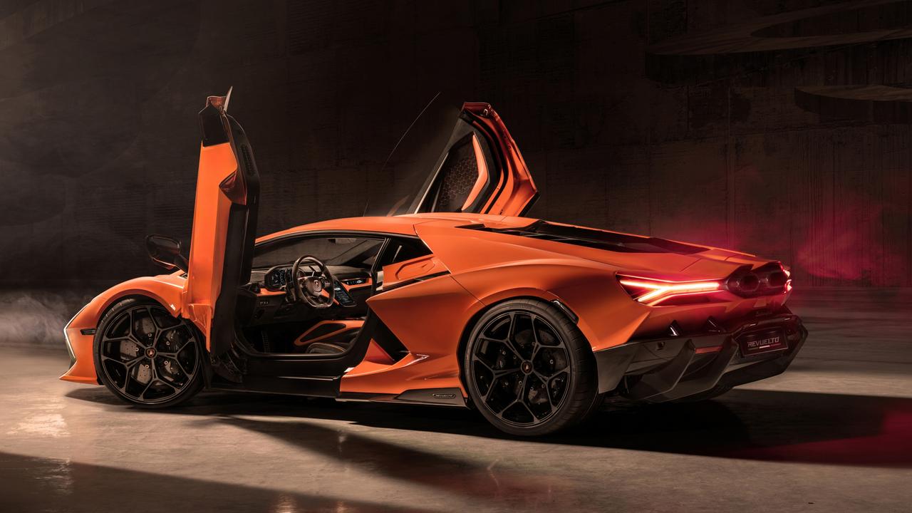 It looks wild, with upward opening scissor doors., This rear-mounted V12 delivers max power above a screaming 9000rpm., It still has a whopping big V12 petrol engine, though., The Revuelto is the brand’s first plug-in hybrid., Technology, Motoring, Motoring News, 2023 Lamborghini Revuelto hybrid supercar revealed