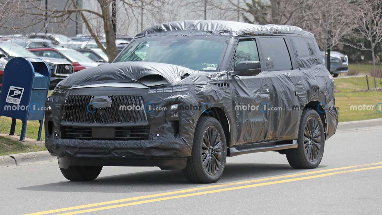 next-gen infiniti qx80 spied for the first time under heavy camo