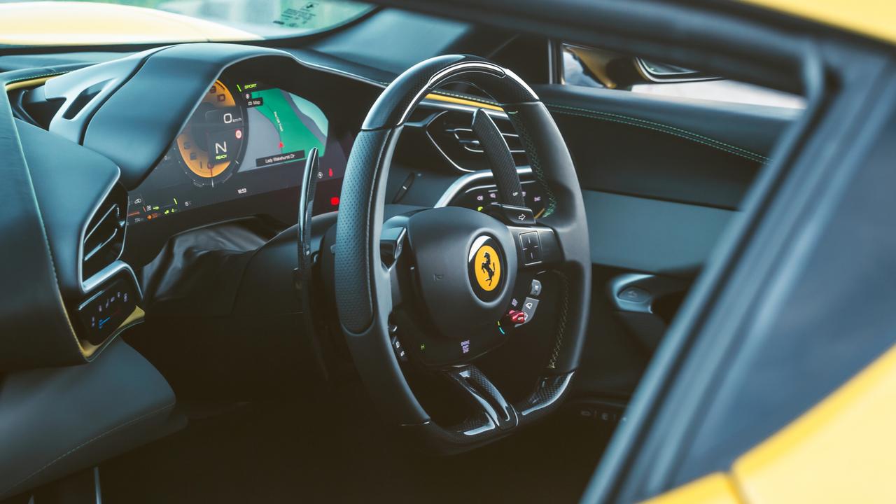 The steering wheel is covered with electronic controls., The Ferrari’s hybrid motor delivers sledgehammer thrust., A targa-topped ‘spider’ variant is around the corner., The Ferrari’s cabin is a hi-tech affair., Like a modern F1 car, the 296 has a hybrid V6 engine., There’s more to this Ferrari than showstopping looks., The Ferrari 296 GTB is the most advanced car in its class., Technology, Motoring, Motoring News, Driving Ferrari’s 296 GTB supercar