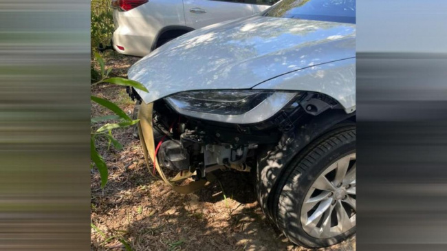 rented tesla model x gets stuck on beach, front then ripped off car