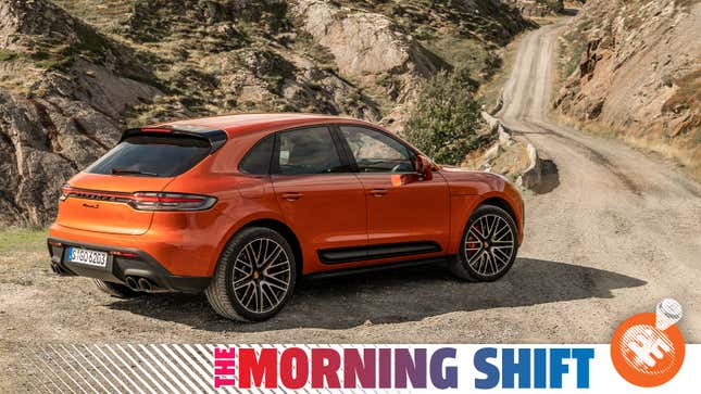 Porsche press image of an orange Macan S on a dirt road, with the Jalopnik 