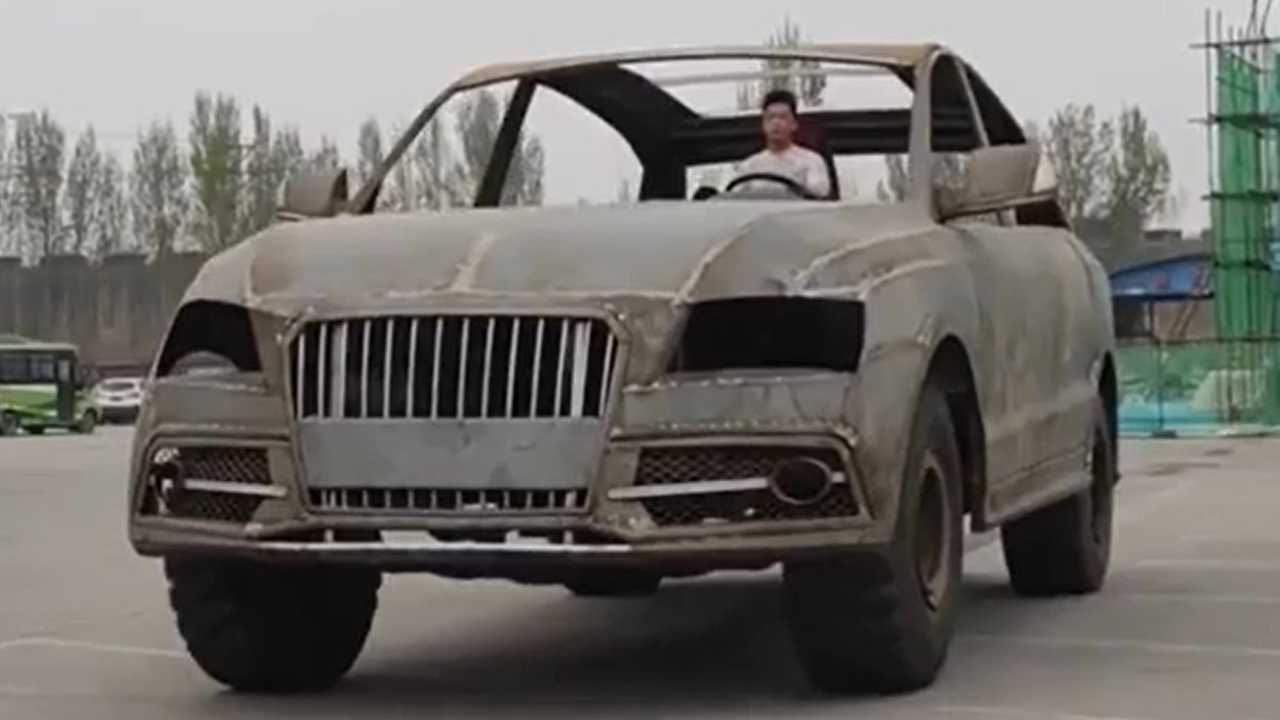 supersized audi q7 made from scrap metal is a sight to behold