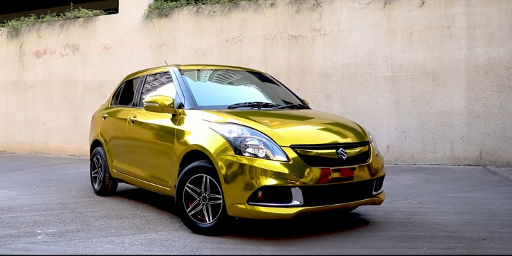 maruti suzuki swift dzire sub-4 meter compact sedan wrapped in gold chrome is an eye-catcher 