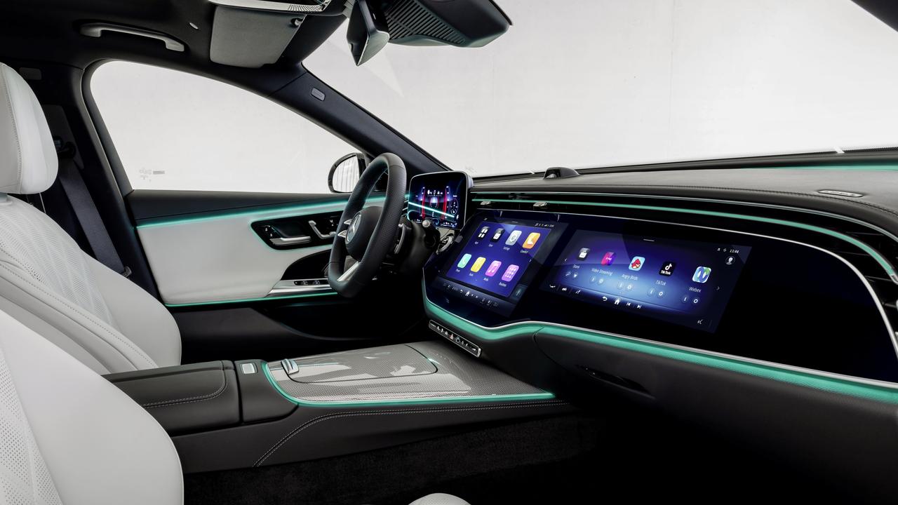 The Mercedes ‘superscreen’ spans the full width of the dashboard., A selfie camera above the dashboard allows the driver to participate in video calls., Mercedes-Benz has updated the E-Class for 2023., Technology, Motoring, Motoring News, Mercedes unveils new E-Class sedan