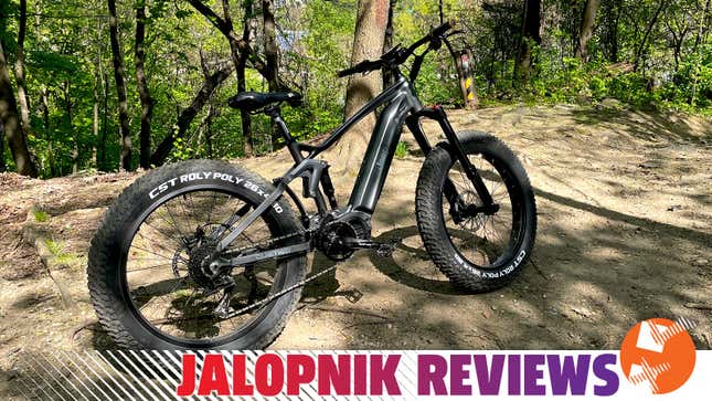 A photo of a grey Jeep e-bike with the Jalopnik Reviews graphic. 