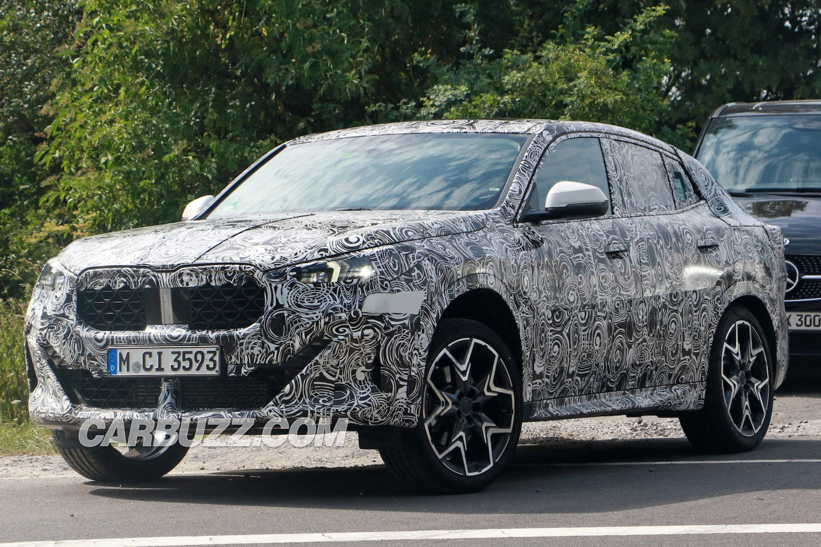spy shots, new bmw x2 peels back camo to reveal smiling face