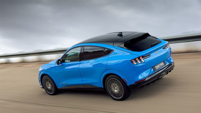 tesla model y, ford mustang mach e, ford news, kia news, tesla news, electric cars, industry news, car news, ev advice, green cars, price stung! 2024 ford mustang mach-e pricing comes down, but will existing customers be forced to pay original costs for tesla model y and kia ev6 rival?