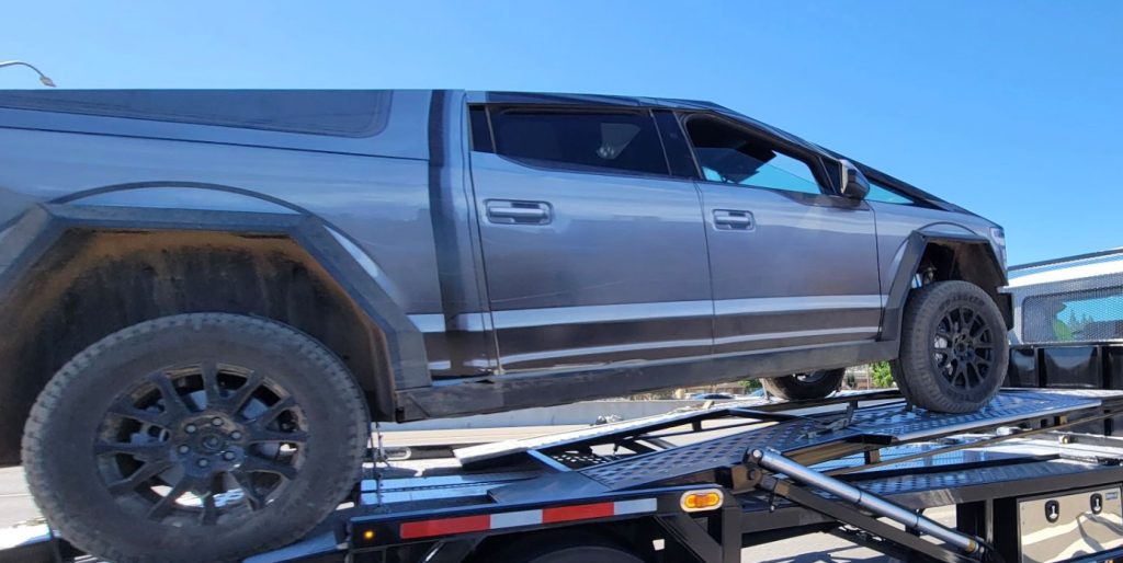 closer look at tesla’s strange cybertruck with ford f-150 wrap