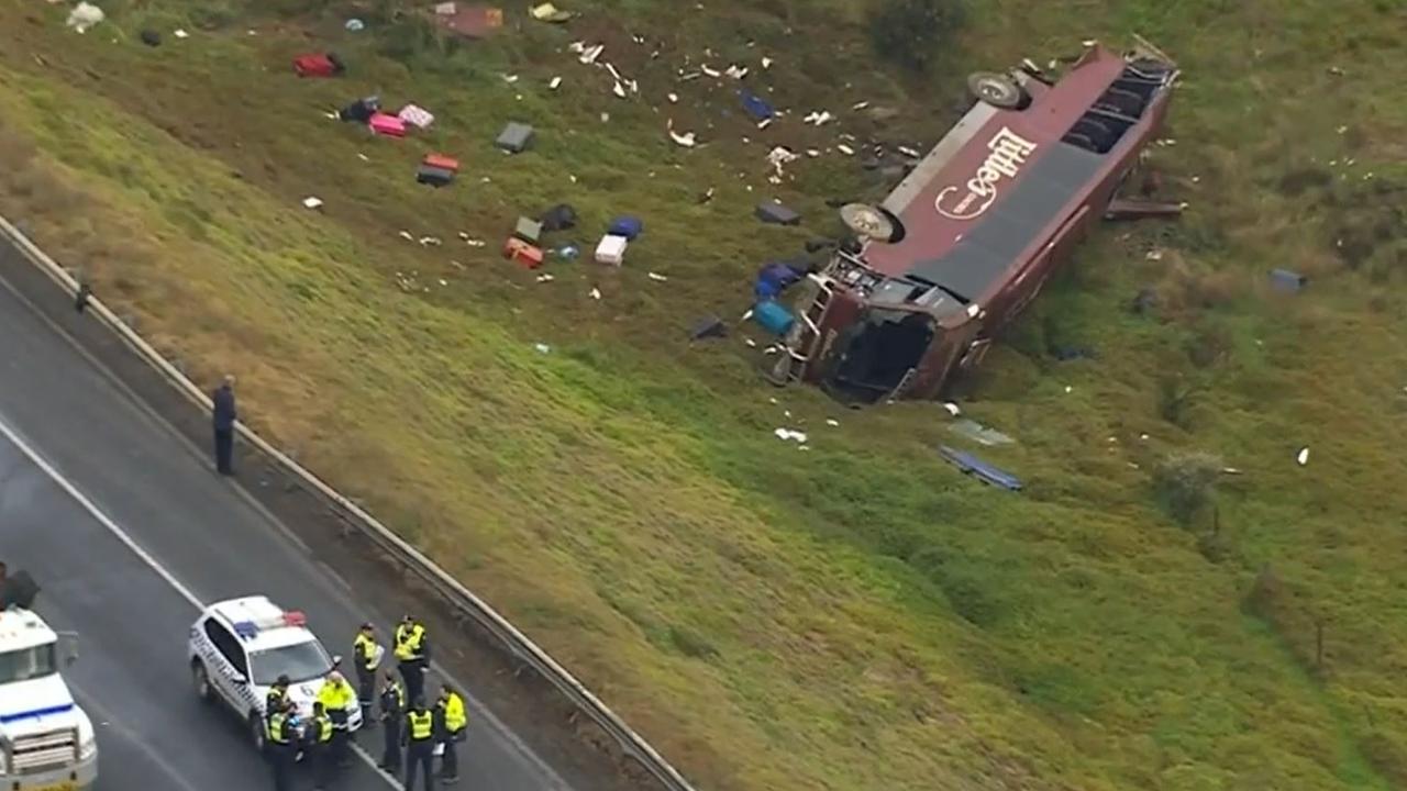 The bus was carrying 32 people, including 27 schoolgirls when it flipped on the Western Highway in Bacchus Marsh on November 21, 2022. Picture: Nine News, Brett Michael Russell is facing 80 charges over the horrific crash with a school bus. Picture: Nine News, National, Victoria, Courts & Law, Twist for truck driver accused of horror crash with school bus