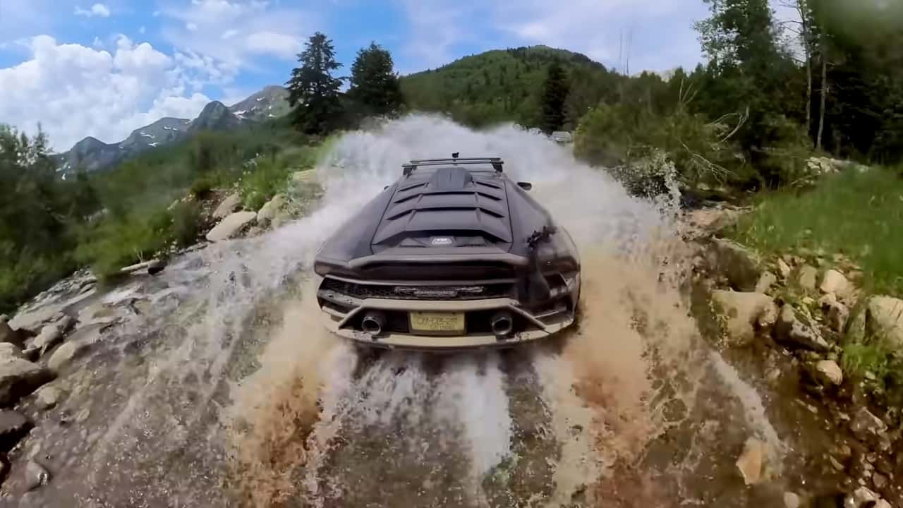 A Lamborghini Huracan Sterrato in a river.