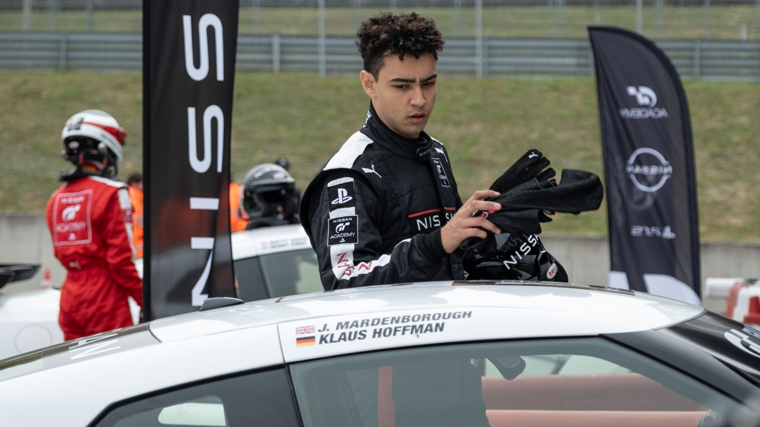 archie madekwe, darren cox, gran turismo, gt academy, jann mardenborough, orlando bloom, video games, gran turismo movie review: there's heart in this gamer-to-racer film