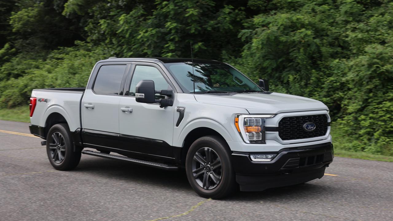 The F-150 is an impressive car., High-end Ford F-150 models rival luxury cars for space and features., Light steering helps make the F-150 easy to manoeuvre., We drove the F-150 on a road trip with the Bronco and Mustang., The works well in wide American lanes., The car’s centre console flips forward to become a workspace., The F-150 has a broad and spacious cabin., Heritage Edition models in the US have two-tone paint., The F-150 is the best-selling car in America., You would be brave to tow anything through an Australian drive-through lane., Technology, Motoring, Motoring News, Why American trucks such as the Ford F-150 are better overseas