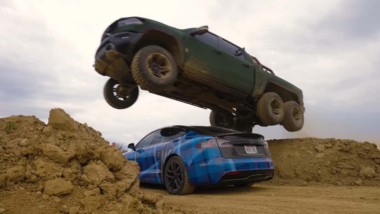 Six-wheeled Ram jumps over Tesla