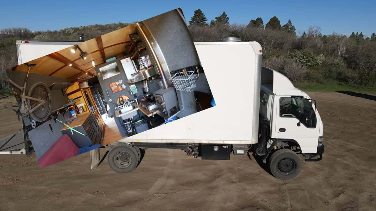An Isuzu box truck made into a camper.
