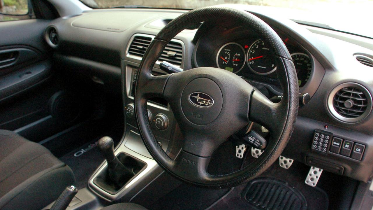 Check out the immobiliser PIN pad next to the steering wheel., The WRP10 has better brakes than a brand-new WRX., Subaru Australia tuned the limited-edition WRX WRP10., The Subaru WRX STI still feels rapid today., Classic WRX models feel light and agile compared to new cars., Sports seats and a Momo steering wheel feature inside the cabin., The 1999 Subaru Impreza WRX cemented the model’s appeal., Subaru invited a handful of lucky reporters to revisit classic WRX models., The first-generation Subaru Impreza WRX is a modern classic., Technology, Motoring, Motoring News, Is the new Subaru WRX as good as the original?