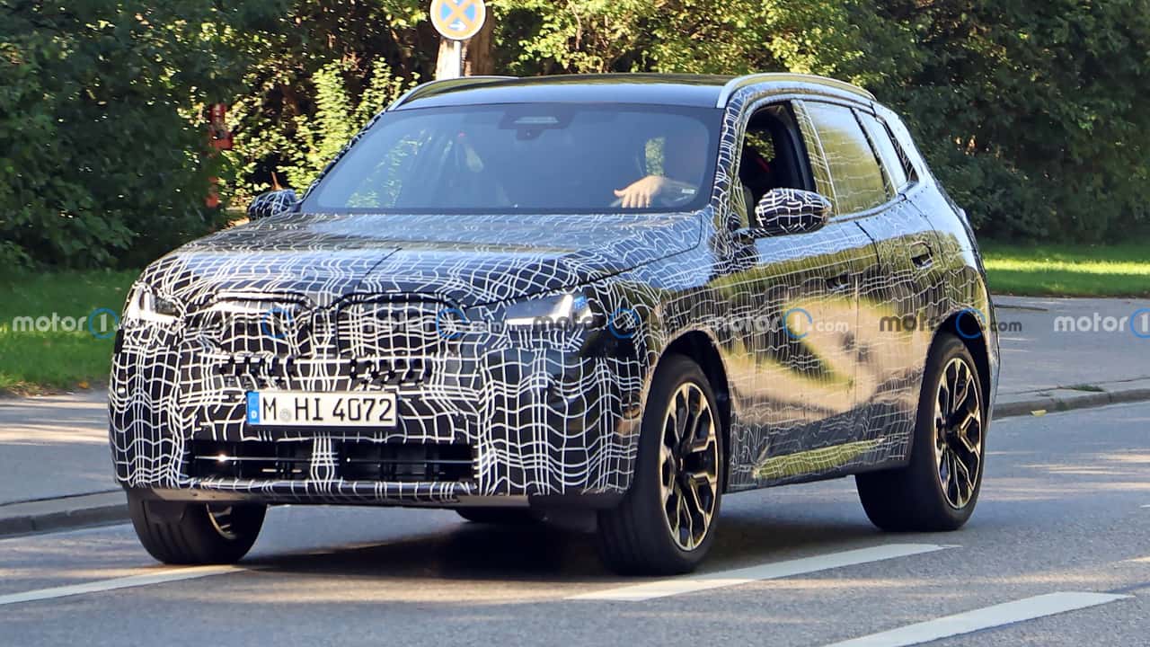 2025 bmw x3 spied showing production lights through camo