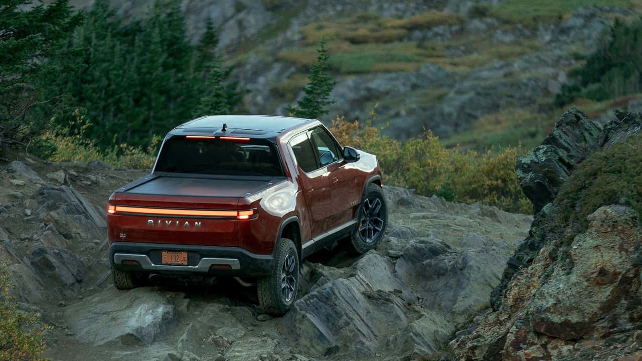 redesigned rivian r1t powered tonneau cover to debut in gear shop in 2024
