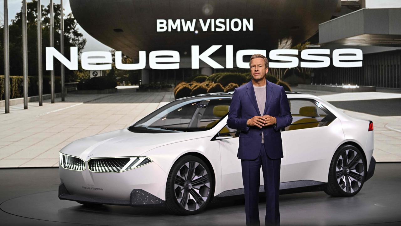 BMW chief executive Oliver Zipse presents the 'Neue Klasse' (New Class) project on the eve of the opening of the Munich Motor Show. Photo: Tobias SCHWARZ / AFP, Mercedes presented the Concept CLA Class during the International Motor Show IAA in Munich. Photo: Christof STACHE / AFP, Technology, Motoring, Motoring News, Automotive giants prepare for war