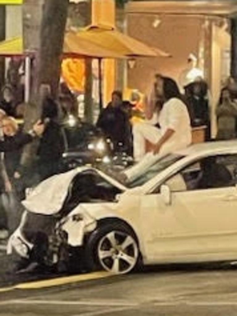 The bustling street was thrown into chaos after a car hit several pedestrians before colliding with two other vehicles. A man sitting on top of one car (right) has been arrested. Picture: Supplied, Multiple cars were badly damaged following a crash near Bourke Street and Russell Street in Melbourne CBD. Source: Facebook, National, Victoria, News, One dead, others injured after car crashes into pedestrians at Bourke Street, Melbourne