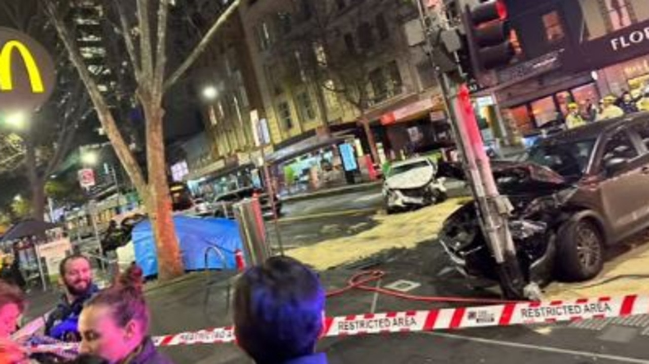 Cars were strewn across the road and people were seen laying on tram tracks following the incident. Source: Facebook, The man was seen being led away by two police officers. Picture: 7 News, Police arrested a man sitting on top of a vehicle after it collided with other cars and pedestrians in Bourke Street on Friday evening. Picture: 7 News, Map of the Bourke Street incident September 9th 2023, The bustling street was thrown into chaos after a car hit several pedestrians before colliding with two other vehicles. A man sitting on top of one car (right) has been arrested. Picture: Supplied, Multiple cars were badly damaged following a crash near Bourke Street and Russell Street in Melbourne CBD. Source: Facebook, National, Victoria, News, One dead, others injured after car crashes into pedestrians at Bourke Street, Melbourne