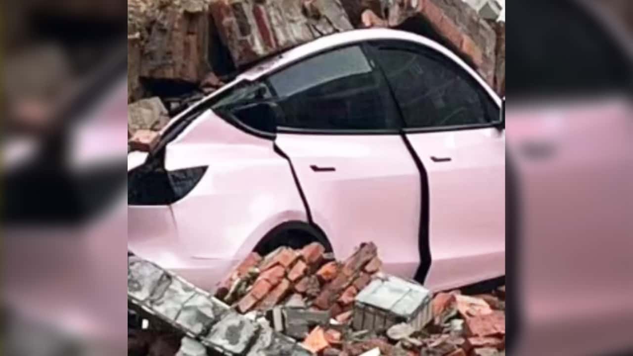 tesla model 3 shows impressive roof strength after brick wall collapses over it