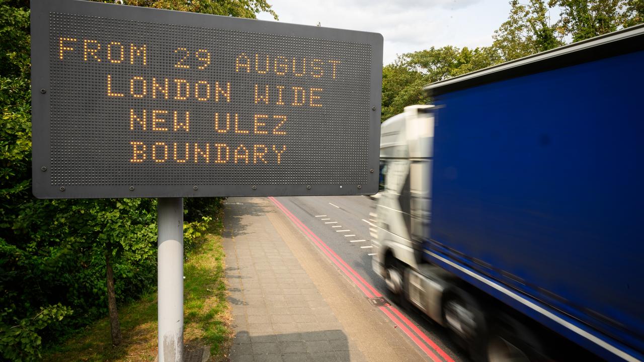 Digital signs warn drivers of the ULEZ expansion. Photo: Leon Neal/Getty Images, Protesters have lashed out against the expanded ULEZ. Photo: Carl Court/Getty Images, New ‘ultra-low emissions zones’ have sparked controversy in the UK. Photo: Leon Neal/Getty Images, Technology, Motoring, Motoring News, Furious UK drivers destroy government emissions cameras
