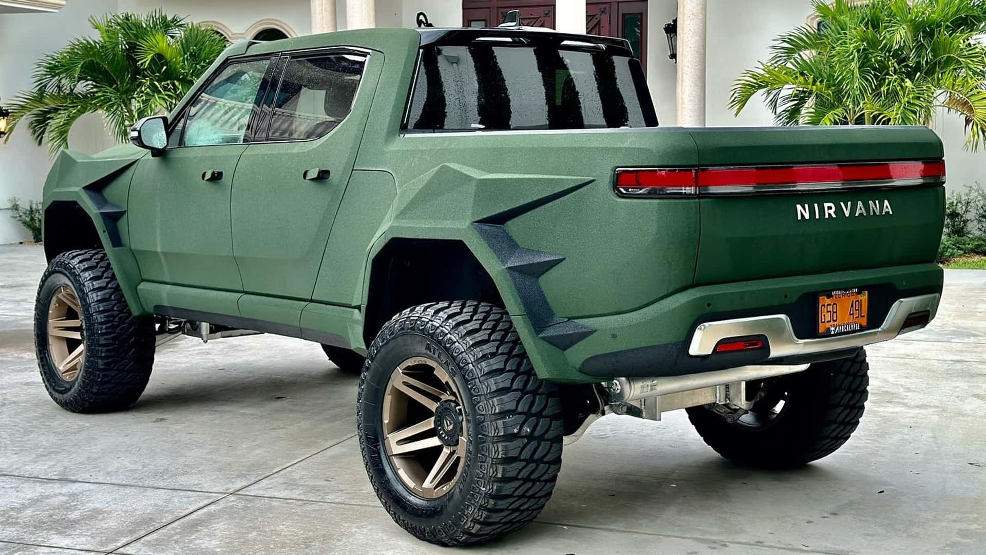 lifted rivian r1t with 38-inch tires looks ready for the apocalypse