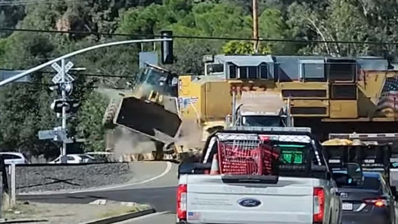 Video captures train colliding with semi-truck. 