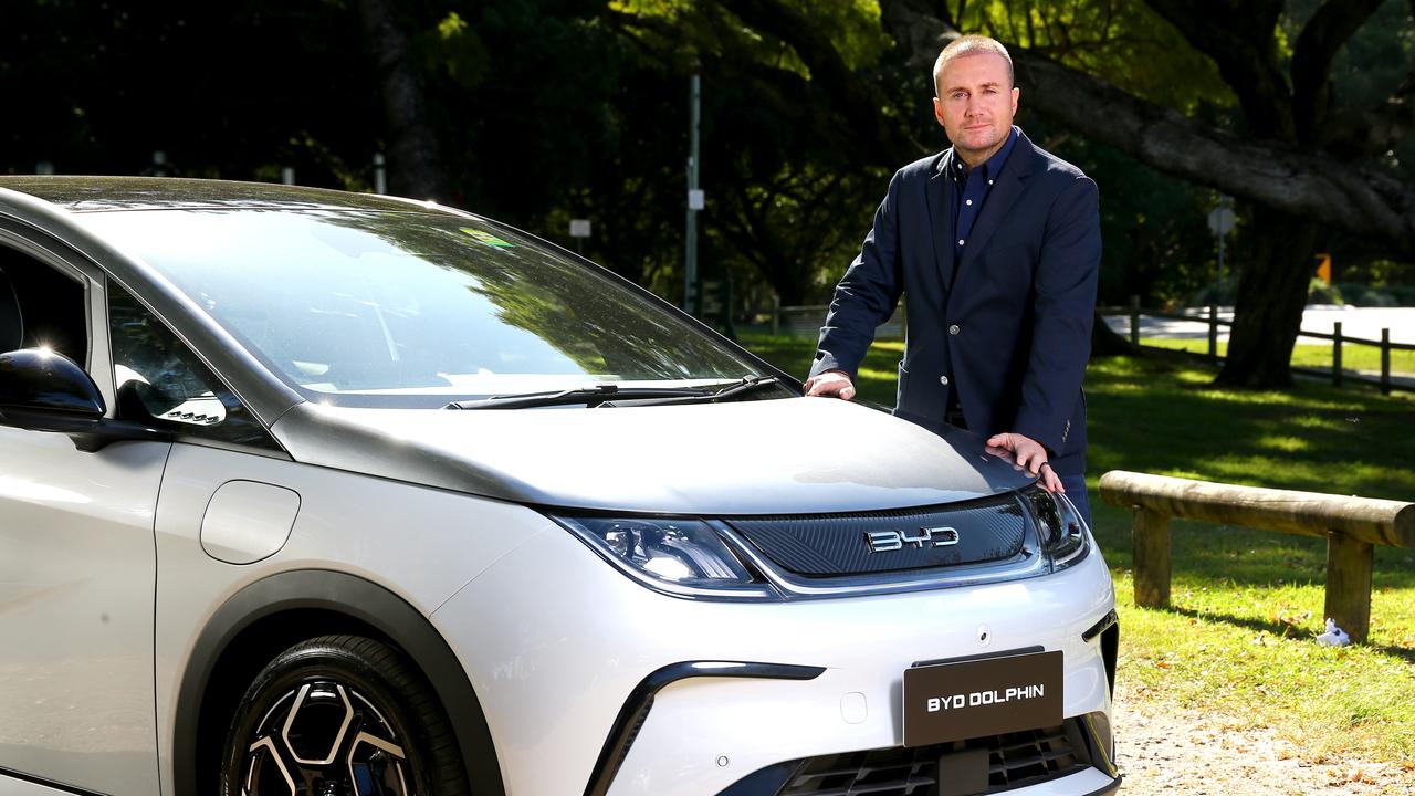 EVDirect.com chief executive Luke Todd pictured with the BYD Dolphin EV. Picture: David Clark, The BYD Seal electric car arrives soon., The Seal’s central touchscreen rotates to display content in portrait or landscape form., The Seal shapes up as an alternative to the Tesla Model 3., The BYD Seal electric car is surprisingly affordable., Technology, Motoring, BYD Seal priced aggressively for Australia