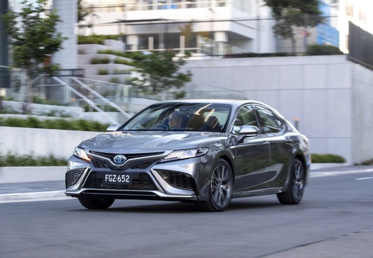 toyota pauses customer orders on camry hybrid as waitlists balloon to 24 months