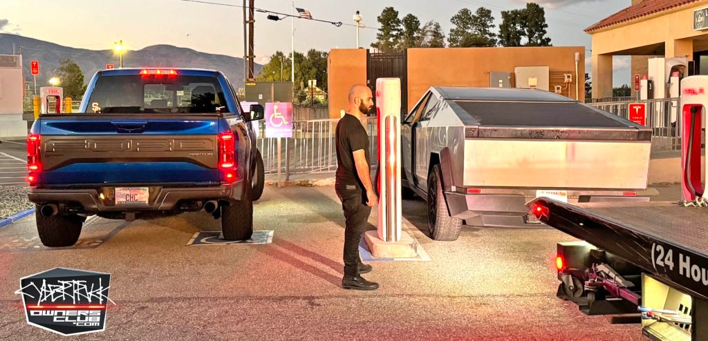 tesla cybertruck breaking down at supercharger gives size comparison with f-150 raptor