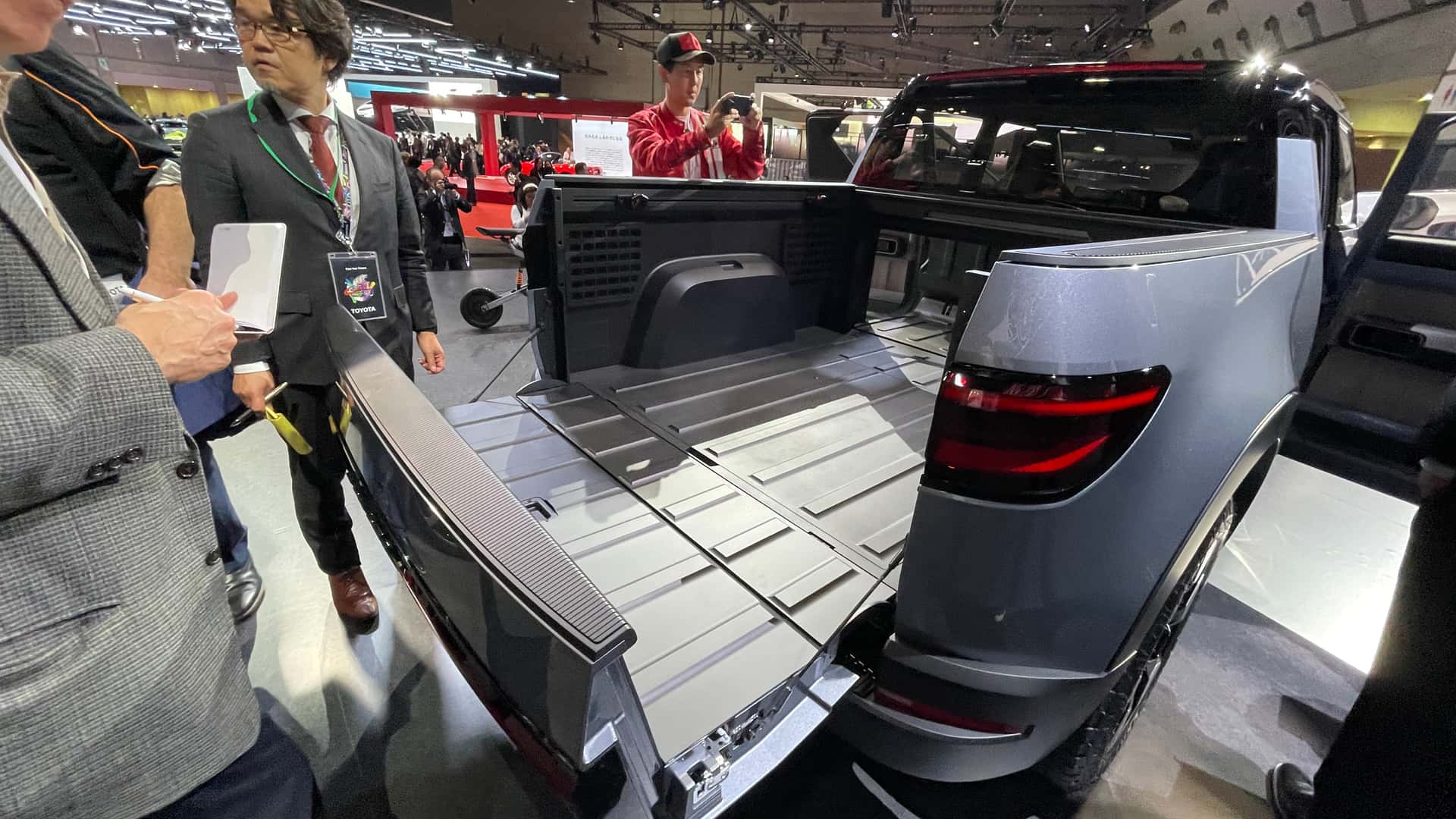 toyota's compact electric truck concept even has a pass-through bed