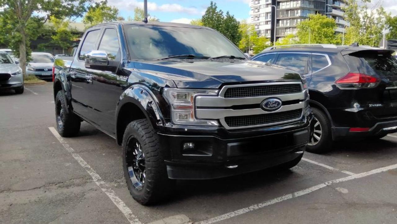 Pictures of American-style pick-up trucks squeezed into standard car spaces routinely spark outrage. Picture: Twitter/X (amy_jelacic), Standards Australia is proposing increasing parking spaces by 20cm to accommodate growing vehicle sizes, Pick-up truck drivers have been routinely called out for their obnoxious parking in Australia., Technology, Motoring, Motoring News, Australians blast proposal to increase standard parking space length as ‘Big Cars’ take over