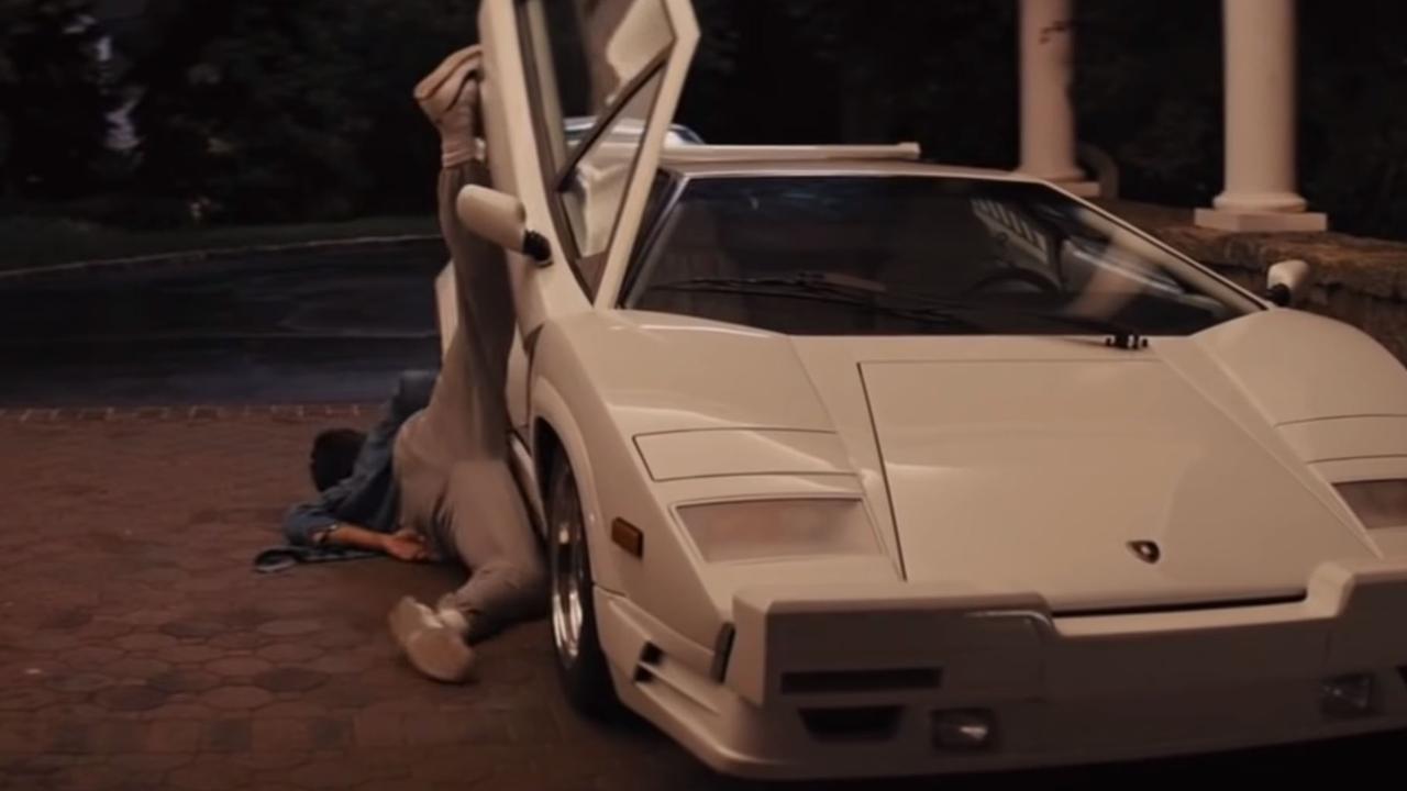 Leonardo DiCaprio with a Lamborghini Countach in The Wolf of Wall Street., This 1989 Lamborghini Countach 25th Anniversary Coupe featured in The Wolf of Wall Street. Picture: Bonhams, Martin Scorsese on the set of Wolf Of Wall Street Picture: Supplied, Leonardo DiCaprio and Margot Robbie pictured filming a scene on the set of, Leonardo DiCaprio with the Lamborghini Countach in The Wolf of Wall Street., Technology, Motoring, Motoring News, Wolf of Wall Street Lambo tipped to fetch $3 million