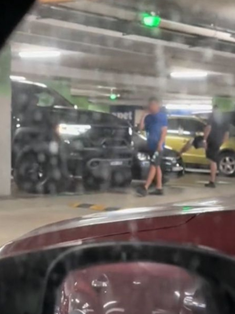 The woman raged at the ‘Tonka truck crew’ in the video. Picture: TikTok, Two men could be seen attempting to reattach the front bumper bar. Picture: TikTok, The large pickup truck allegedly ‘sideswiped’ a sedan while parking. Picture: TikTok, Technology, Motoring, Motoring News, Pickup ‘monster truck’ carpark sideswipe crash sparks outrage