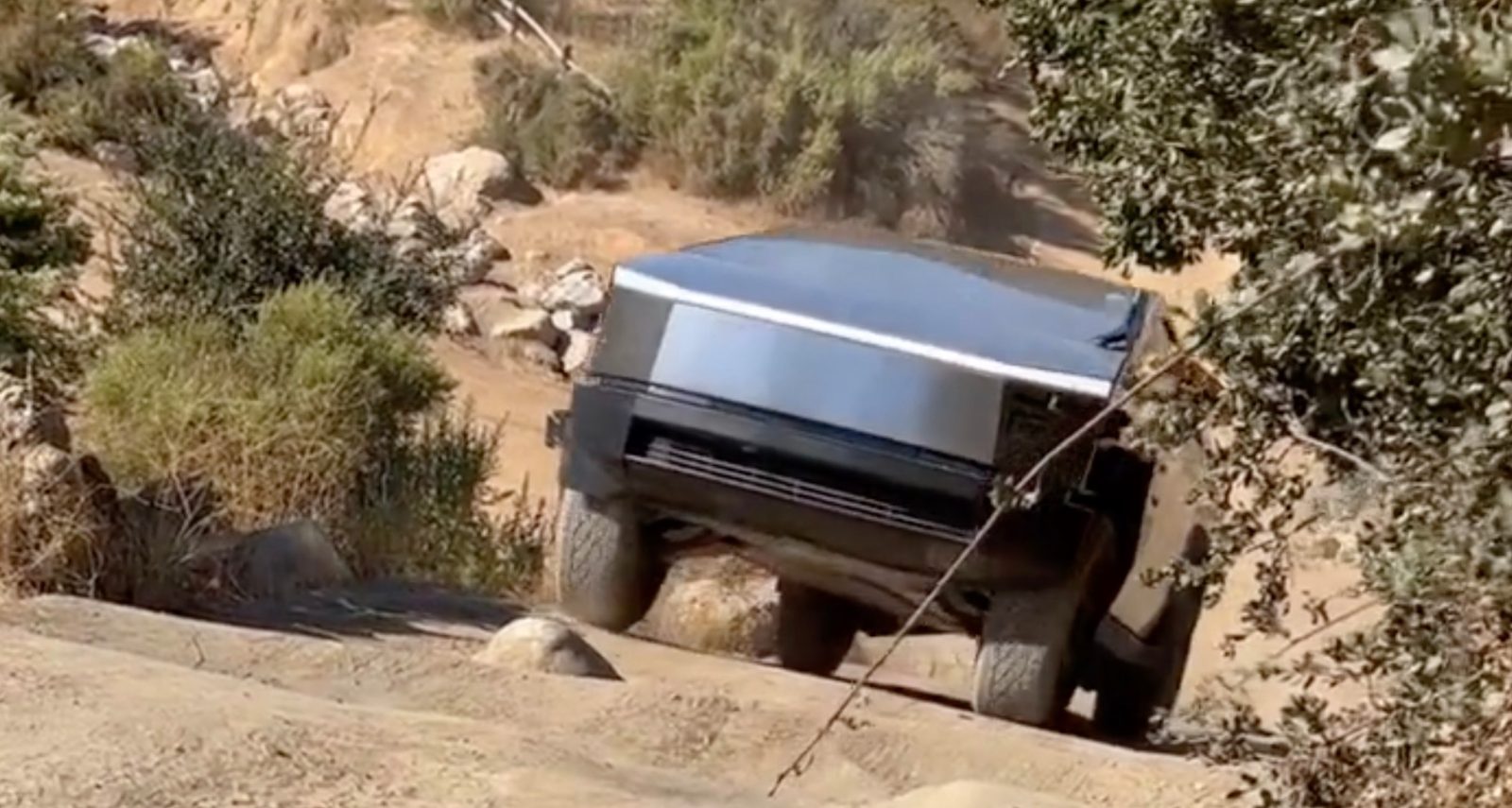 tesla cybertruck spotted climbing stairs off-road – showing great ground clearance