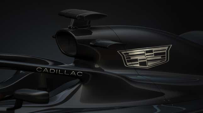 A gold Cadillac logo on a black F1 engine cover