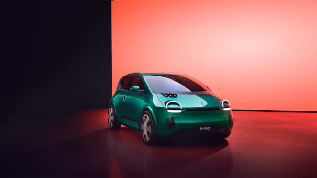 A render of the new Renault Twingo concept in emerald green in front of a light red background. It is so cute.