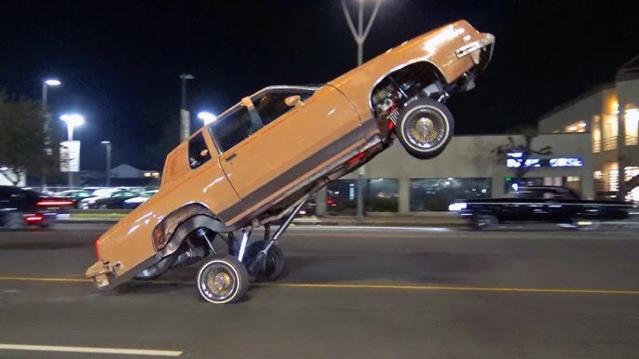 Sometimes, low-riders are fitted with hydraulics that let them jump and hop. Picture: YouTube., Low-riders cruise in Elysian Park, Los Angeles. Picture: YouTube., Technology, Motoring, Motoring News, California lifts ban on cruising in low-rider cars