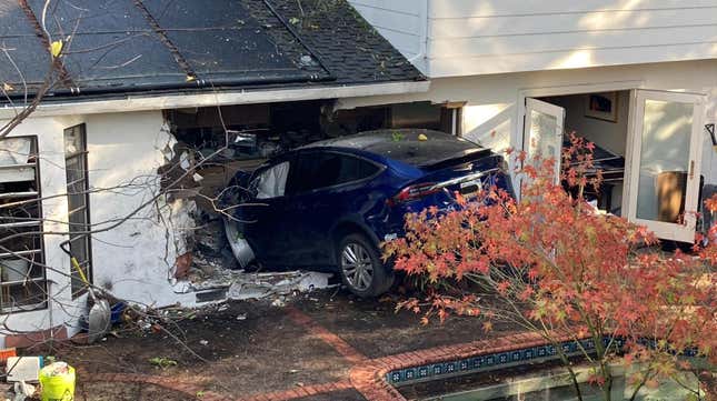 A blue Tesla Model X that crashed into a California house
