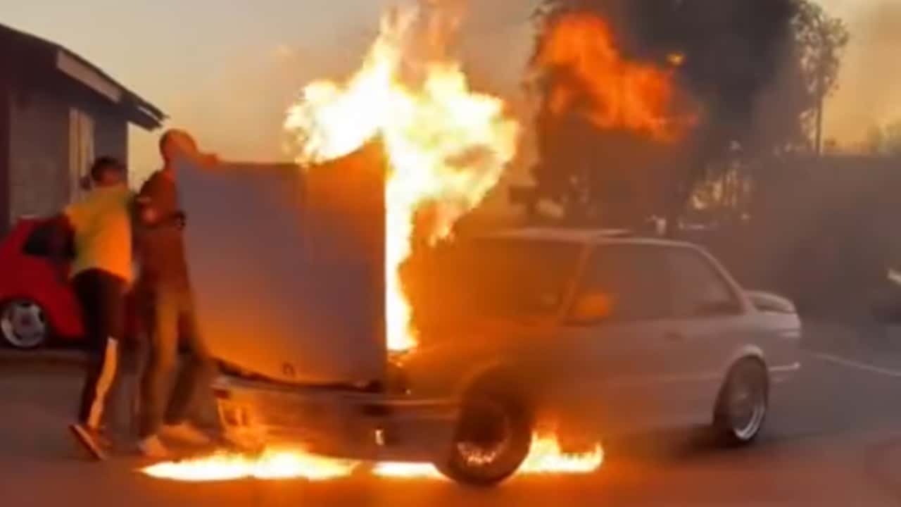 watch a pristine bmw e30 go up in flames after it springs a leak