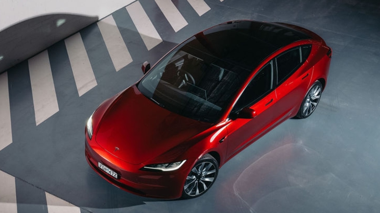 Range has been slightly improved too., Tesla has made the steering wheel even more minimal by removing the indicator and gear selector stalks., Tesla has made broad changes inside and out., Tesla will start deliveries of the new Model 3 in January., Technology, Motoring, Motoring News, 2024 Tesla Model 3 revealed in Australia